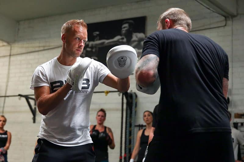 box n burn instructors sparring in the ring