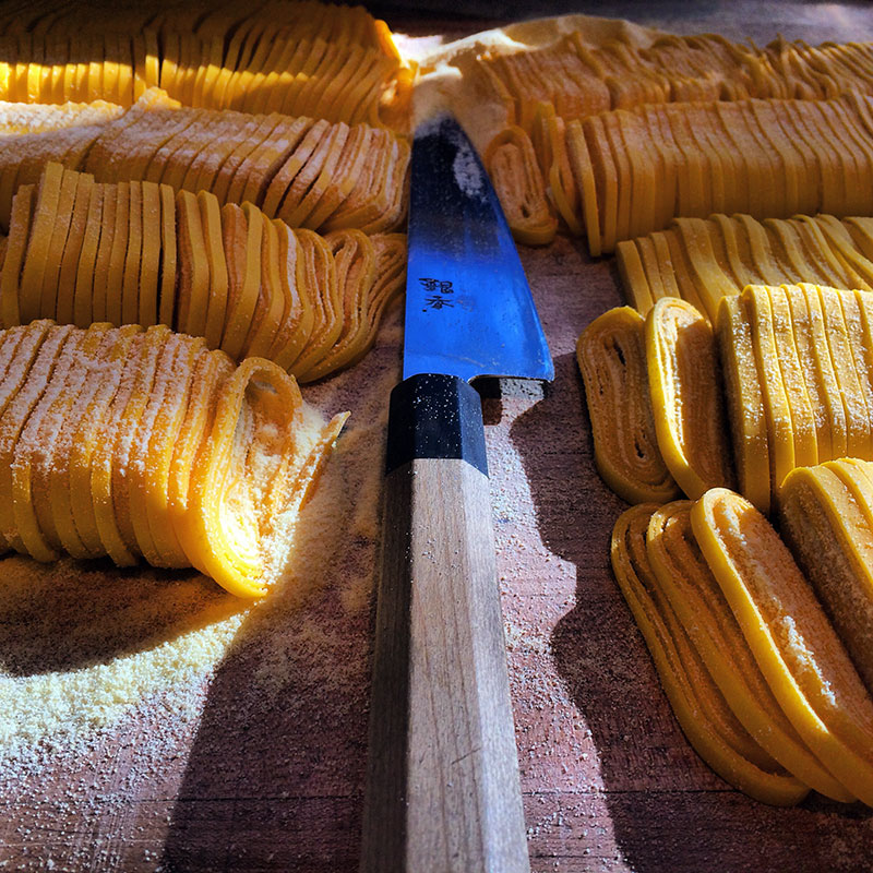 cutting linguini pasta