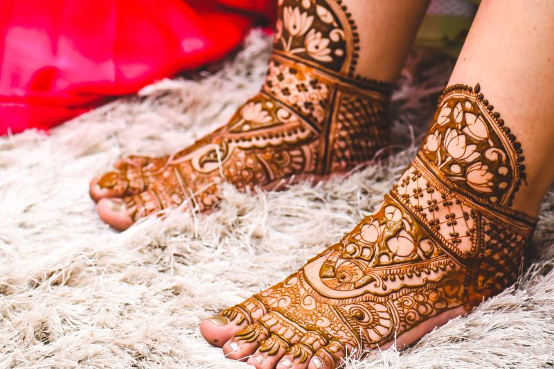 indian bride feet covered with henna