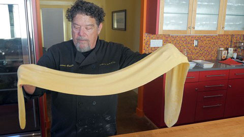 italian chef Giovanni Gaudio making pasta