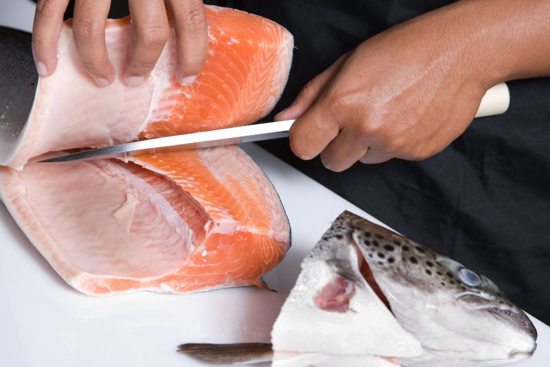 japanese chef cutting raw fish