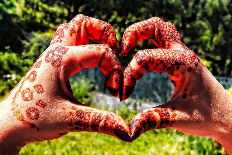 teacher hands with henna art
