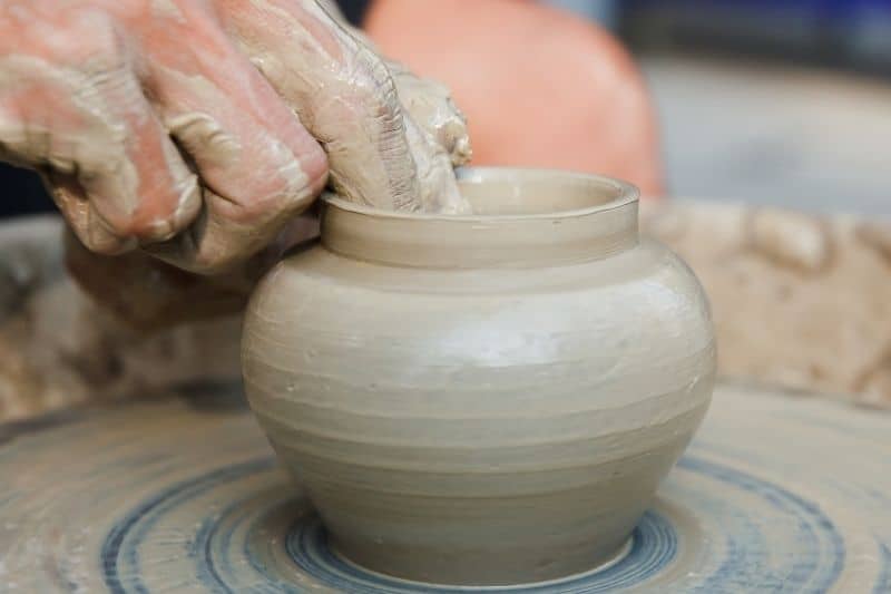 turning pottery on a wheel